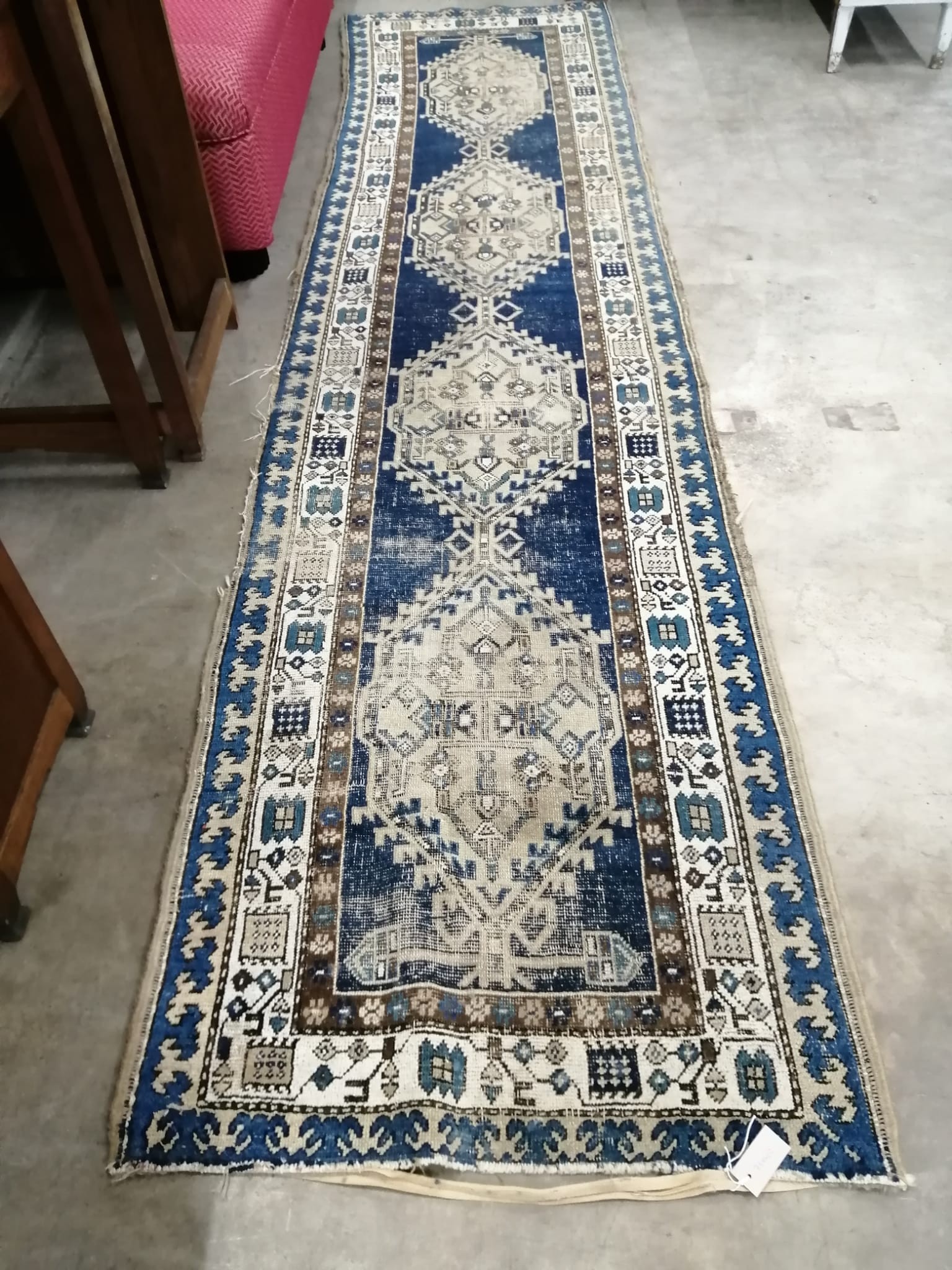 An antique Caucasian blue ground runner, worn, 370 x 90cm